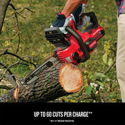 Photo of Craftsman cordless chainsaw CMCCS620M1 cutting a tree branch outdoors, red and black design.
