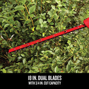 Photo of Craftsman hedge trimmer dual blades in use, cutting thick green bushes, CMCPHT818B.