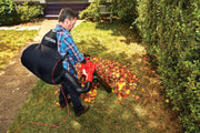 Photo of CRAFTSMAN leaf blower with collection bag, SKU CMEBL7000, used on lawn with autumn leaves.