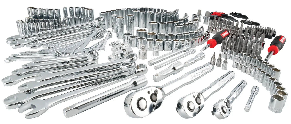 Photo of CRAFTSMAN CMMT45938 mechanics tool set with chrome wrenches, ratchets, sockets, screwdrivers, front angle on white.