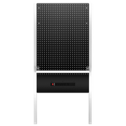 A CRAFTSMAN branded black pegboard panel with white metal frame, featuring a built-in electrical outlet strip below the pegboard area. The pegboard has evenly spaced holes for tool storage or organization.