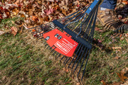 Photo of CRAFTSMAN leaf rake SKU CMXMLTP35316 in use on grass and leaves, close-up on rake tines and label.