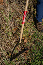 Photo of Craftsman weed cutter CMXMLTP35318 with wood handle in outdoor grass setting.