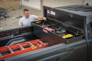 Craftsman CMXTBAK1005301 truck toolbox on pickup bed, open with hand tools and accessories organized inside.