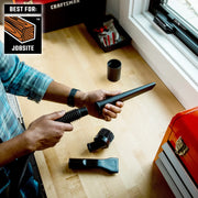 Photo of CRAFTSMAN CMXZVBE38611 vacuum accessory set for jobsite, including crevice tool, brush, and nozzle on workbench.